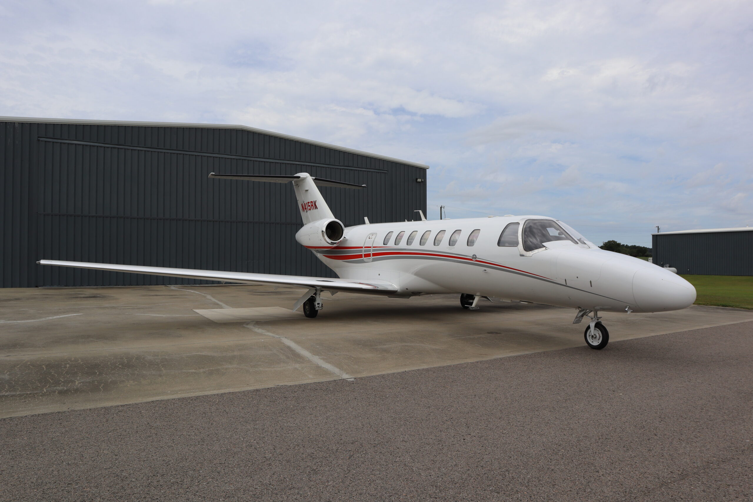 Cessna Citation CJ3 Plus in front of hangar