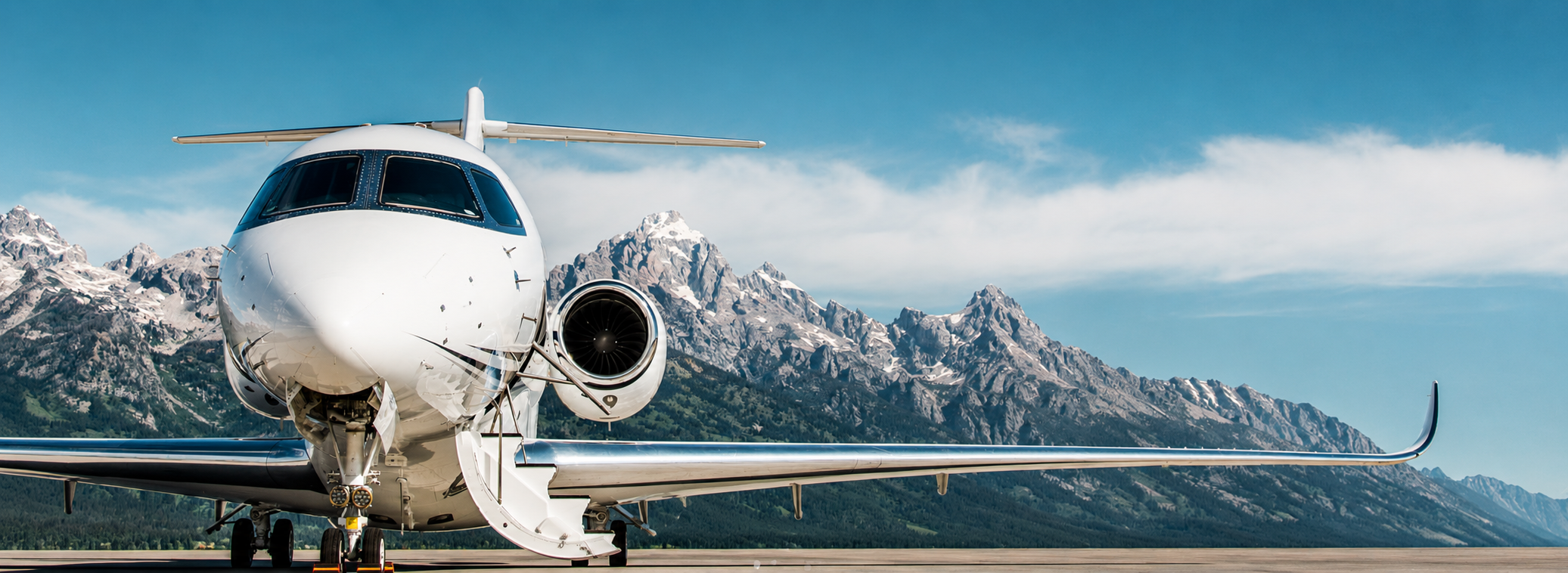 Cessna Citation Longitude ready to board in front of mountains