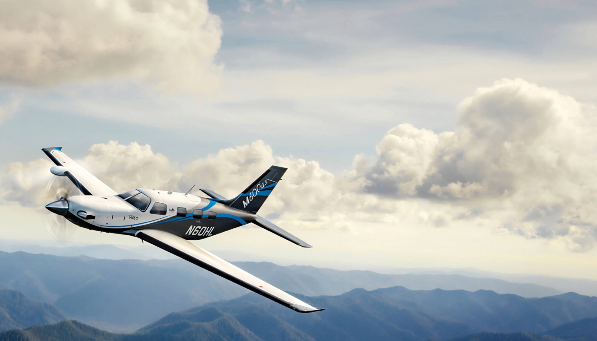 Piper M600 gliding over mountains
