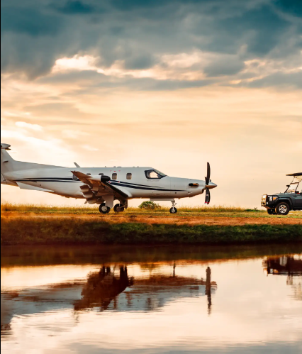 Pilatus PC-12 next to a pond at sunset