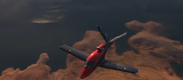 Cirrus SF50 Vision Jet in flight over a canyon
